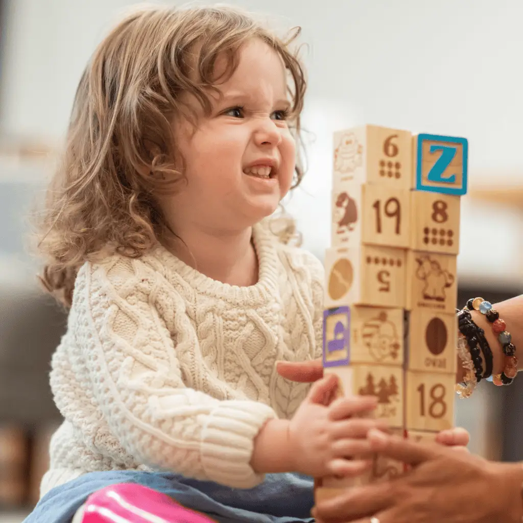 Child receiving craniosacral therapy for developmental support and relaxation.