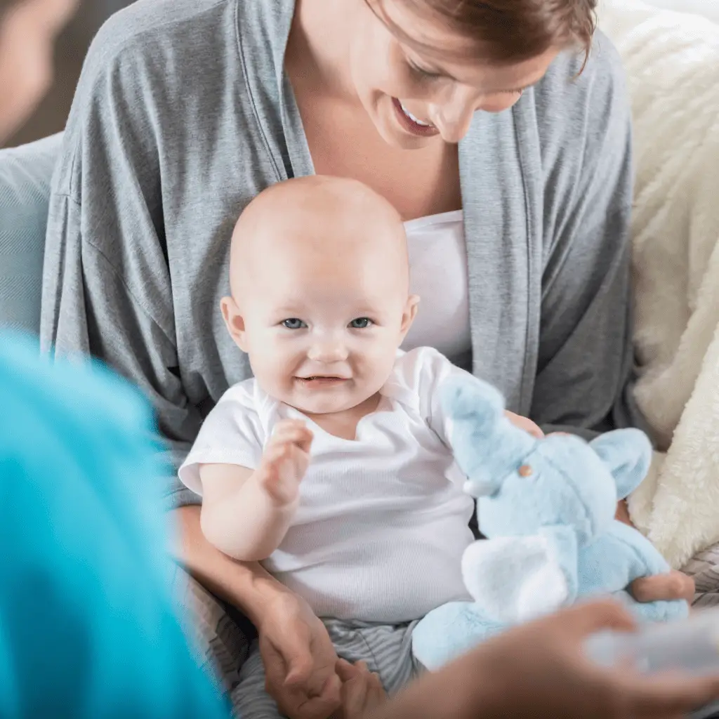 Mother holding baby during lactation support, promoting breastfeeding health and bonding.